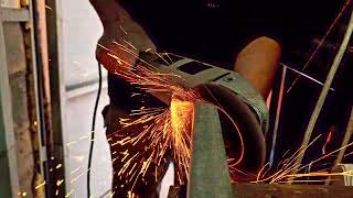 angle grinder with flap disc is polishing end of steel channel after cutting in a garage [upl. by Roee979]