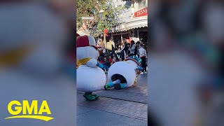 Adorable Disney snowman takes a tumble during Disneyland parade [upl. by Ebeneser]