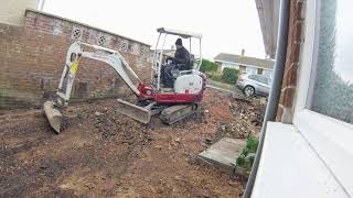 Digging up an old tarmac driveway with a Takeuchi Excavator mini digger [upl. by Adnama]