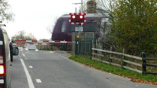 East Midlands Railway train crosses B1191 Level Crossing at Scopwick Lincolnshire England 151124 [upl. by Malvie]