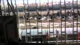 Video of Sendai Airport being engulfed by a Tsunami shot from inside the Airport [upl. by Goldia445]