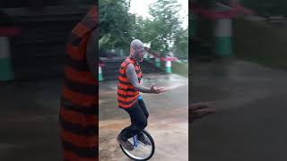 Unicycles unicycling penny farthing high wheel mike arotsky in thailand temple sings daydream [upl. by Allicerp]