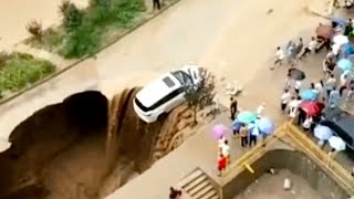 Man Films MONSTER SINKHOLE Nearly Swallow Car [upl. by Amolap]