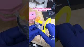 How to properly insert a sensor into a film holder when using an XCP dentalassistant dental [upl. by Jerusalem]