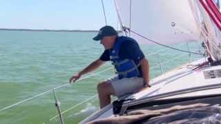 Offshore Sailing School  Adjusting the Fairlead on the Loaded Jib Sheet [upl. by Ayikaz357]