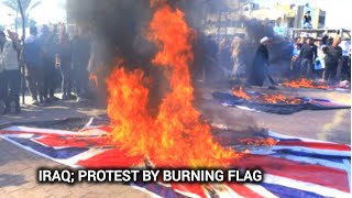 Iraq residents burn flags in protest against the UK US and Israel [upl. by Eibbil]