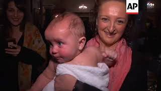 Hundreds of babies are baptised in mass ceremony [upl. by Anirehs]