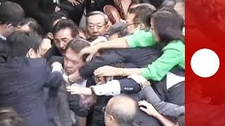 Unusual clashes erupt in Japan parliament over security bills [upl. by Lehte]