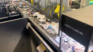 An AI robot picks up cans at The Exchange an LRS recycling sorting center in Chicago [upl. by Lerner]