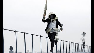 Who Was the Hooded Parkour Character with the Olympic Torch  Revealed [upl. by Hiltner]