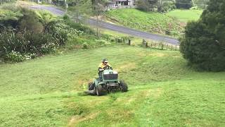 Steep slope mowing with modified John Deere 4wd Rideon mowers [upl. by Issirk]