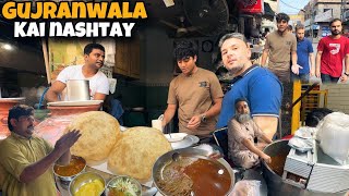 CRAZY FOOD STREET GUJRANWALA PAKISTAN 🇵🇰 DESI NASHTE IN GURUNANAK PURA  HALWA POORI BABY NAAN [upl. by Purse]