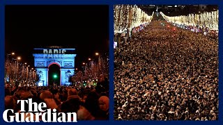 More than 1m people gather in Paris to watch New Years Eve firework display [upl. by Lexa813]