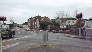 Two trains at Bedhampton level crossing Hampshire [upl. by Porcia]