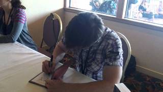 Yuri Lowenthal signing and saying a line by Sasuke Uchiha [upl. by Einohpets860]