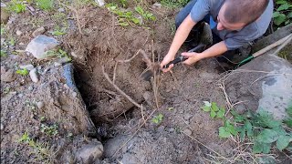 Unclogging Digging Out Culvert Blocked By Boulders [upl. by Carver]