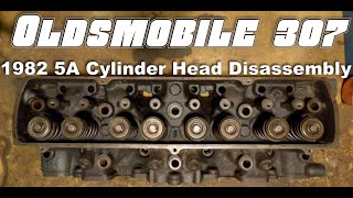 Oldsmobile 307 Cylinder Head Disassembly [upl. by Nywra]