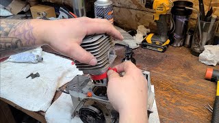 How to port a chainsaw part 11 Tips for installing a piston and cylinder [upl. by Cottrell]