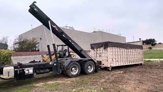 Freightliner roll off truck hoisting the dumpster to retract it Full of composting and tree cutting [upl. by Gnilyam]