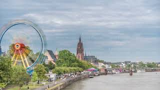 Aerial hyperlapse of pleasure boats on the Rhine Main framed by the spire of Kaiserdom St [upl. by Evadnee333]