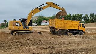 powerfull caterpillar on working digging and loading dirt to big truck [upl. by Llenrac930]