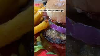 Juicy turkey bacon burger with cheese red onionsmayo mustard and ketchup on a toasted bunamp fries [upl. by Nnylaehs]