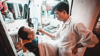 The Vietnamese street barber shave Hanoi Vietnam [upl. by Deelaw311]