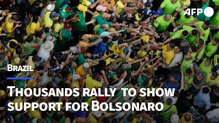 Thousands rally in Sao Paulo to show support for expresident Bolsonaro  AFP [upl. by Soinotna]