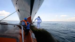 Behind the scenes Queen Mary 2 Captain photographed on the bulbous bow [upl. by Adlare848]