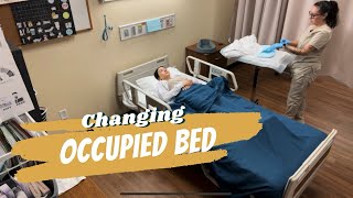 CNA SKILLS  Changing an occupied bed [upl. by Suoicul]