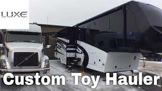 Luxe Toy Hauler luxury fifth wheel  pulling with Volvo  Smart Car on top [upl. by Schwing489]