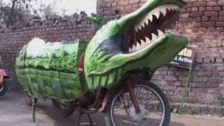 Man rides crocodile motorbike around India [upl. by Leonelle]