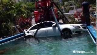 CCTV captures car crashing into swimming pool [upl. by Ten]