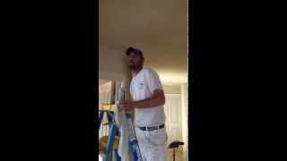 Caulking a ceiling to wall crack before painting [upl. by Anuala]