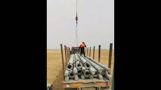 Outdoor lifting of cement poles Good tools and machinery make work easy [upl. by Ynnob]