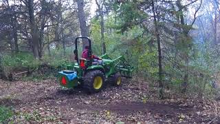 John Deere 3038E Tractor amp Grapple  Clearing underbrush [upl. by Eico]