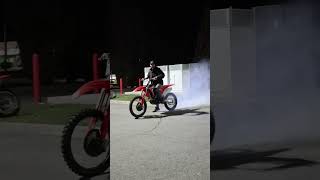 CRF burnout in Tesla chargers 💨burnout honda CRF tesla electric ebike shorts [upl. by Euqinot]