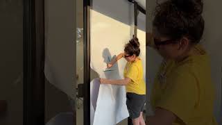 How to apply perforated vinyl to store windows shorts howto vinyl business [upl. by Teodora89]