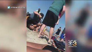 Wildwood Police Investigating Video Showing Officer Punching Woman On Beach While Trying To Subdue H [upl. by Ainnet]