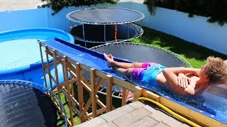 GIANT Backyard Water Slide in our Trampoline Water Park [upl. by Ohara]