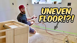 Installing Kitchen Cabinets on an Uneven Floor [upl. by Sirromad]