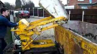 tracked dumper loader skip dozer tipping into a skip [upl. by Hoenack52]