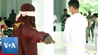 Man and Woman Receive Harsh Punishment in Aceh [upl. by Bez190]