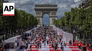 The ChampsÉlysées in Paris is transformed into a massive table for a special picnic [upl. by Plath73]