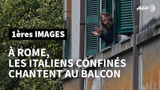 À Rome les Italiens confinés chez eux à cause du coronavirus chantent au balcon  AFP Images [upl. by Annair686]