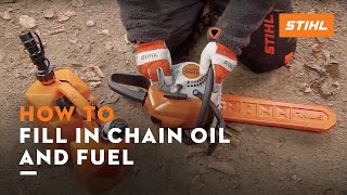 Filling a STIHL chainsaw with fuel and chain oil [upl. by Ravert]