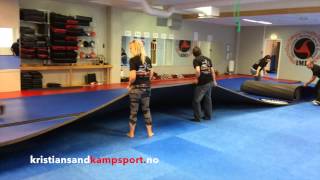 Setting up the new Dollamur mats Kristiansand Kampsport Senter Norway 2014 [upl. by Aitat27]