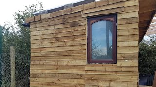 Cladding the pallet sheds DIY pallet shed man cave shed [upl. by Zack]