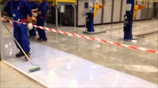 Applying an epoxy resin flooring system and getting the air bubbles out [upl. by Adlesirk427]