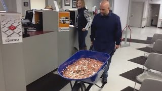 Man Pays Nearly 3000 Bill Using A Wheelbarrow Full Of Pennies [upl. by Wiebmer555]